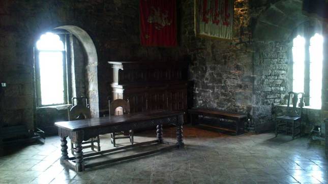Another large table and two chairs take centre stage in the great hall.