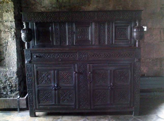 An ornately decorated cabinet in the great hall.