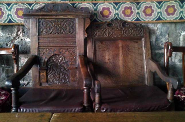 A close-up of some of the detail on the two seats for the lord and lady at the top table in the Dalcassian Room.